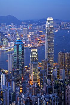 Some of Hong Kong's tallest buildings, including IFC2, seen from The Peak of Hong Kong Island at twilight.