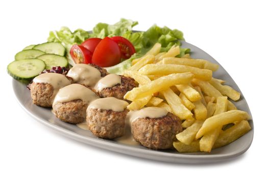 Generally thought of as the Swedish national dish, meatballs with cream sauce, chips, salad and lingonberry jam