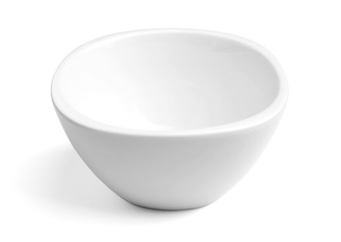 Empty white porcelain dinner bowl on white background with soft natural shadow. Clipping path included.