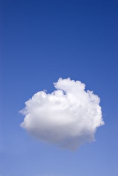One perfect, fluffy white cloud, in a blue sky.