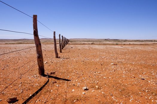 Fenceline in southern Queensland in the Australian Outback.