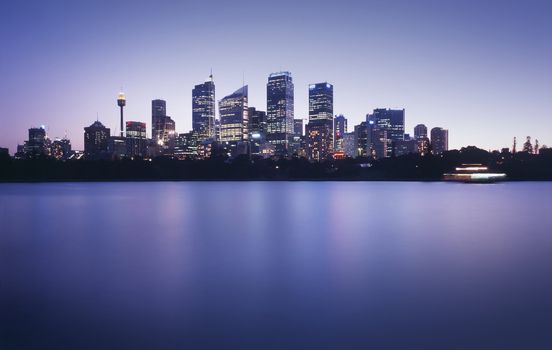 Sydney CBD, reflected in the water of Sydney Harbour, just after sunset.