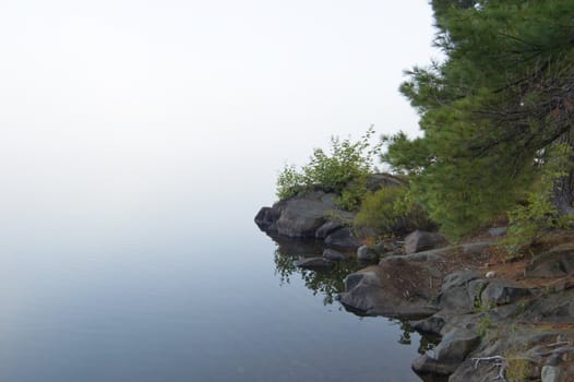 Stones shore of the lake in the erly morning