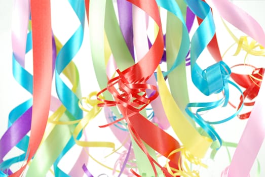 Multicolored ribbons hanging from top