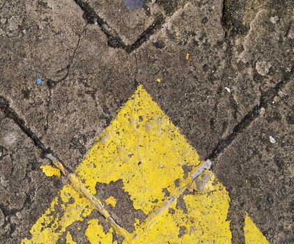 forwarded yellow arrow on the road 