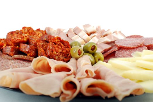 Catering food with cheese olives and delicatessen close detail