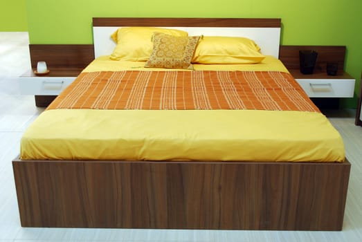 New modern colorful bedroom with bed and cabinet