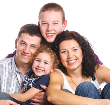 Portrait of happy Caucasian family smiling together on white background