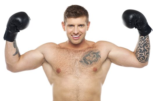 Half length portrait of smart male boxer gesturing success. Won fight