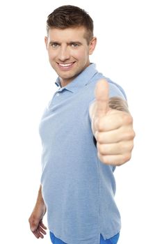 Handsome caucasian male showing  thumbs up to you