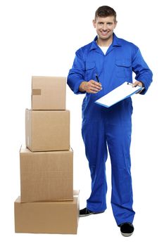 Courier staff offering pen and clipboard to recipient for signature