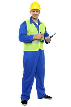 Full length portrait of male architect signing business documents
