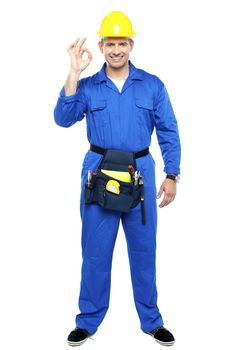 Keep up the good work. Repairman gesturing. Full length portrait
