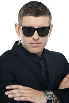 Close up picture of young smart bouncer looking at camera
