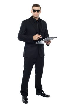 Male bouncer holding clipboard isolated against white background