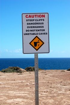 Safety sign nearby cliffs