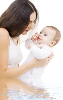 picture of happy mother with baby in water