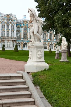 View of sculptures on  background of  Catherine Palace, Tsarskoye Selo, Russia.