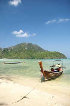 boat on tropical ko phi phi beach in thailand