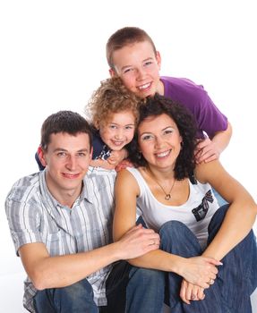 Portrait of happy Caucasian family smiling together on white background