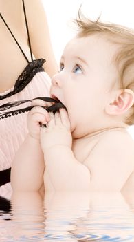 closeup portrait of adorable baby boy in mother hands