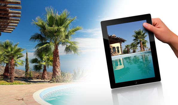 Tropical Scene with swimming pool and tablet pc