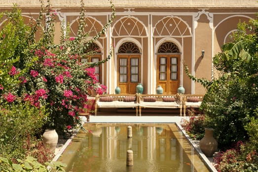 hotel interior garden with pond in yazd iran