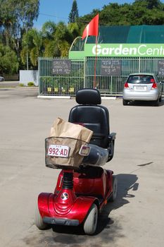 Senior sitizen electric machine in Australian street