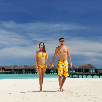 Couple on a tropical beach at Maldives