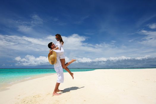 Couple on a tropical beach at Maldives