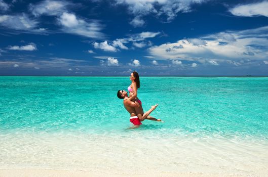 Couple on a tropical beach at Maldives