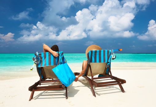 Couple on a tropical beach at Maldives