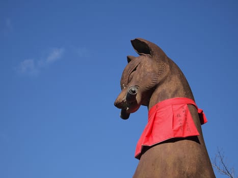 Fox statue at Fushimi Inari Shrine in Kyoto, Japan