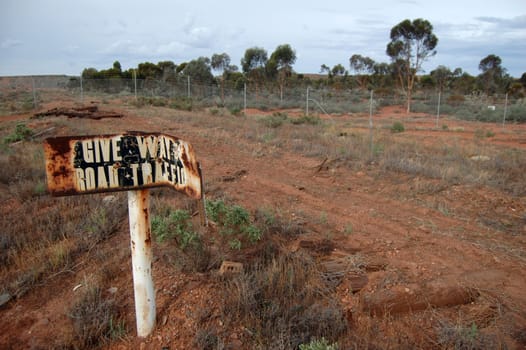 Abandoned road sign near closed road, Western Australia