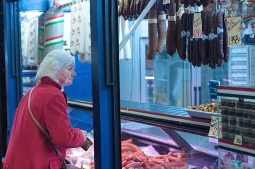 Old lady at the butcher shop