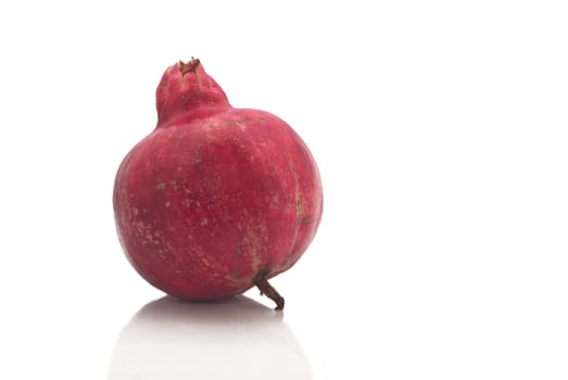 Ripe pomegranate fruit isolated on white background