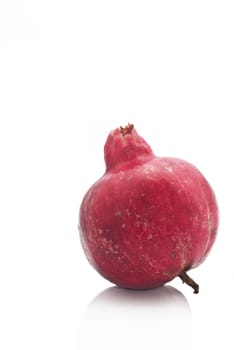 Ripe pomegranate fruit isolated on white background