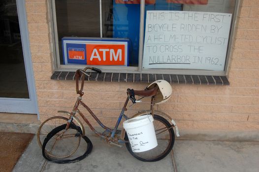 Abandoned bycicle at the gas station in outback