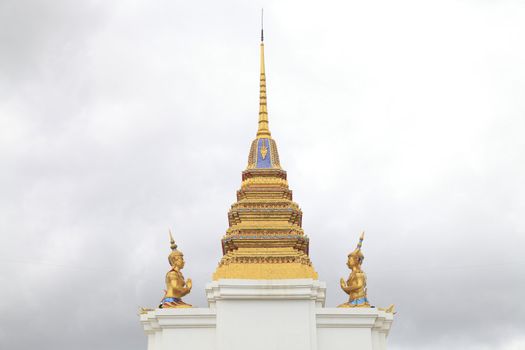 Pair of Thai god (deva) pay respect to the golden pagoda