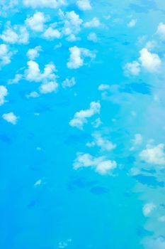 view from above of cloud and and their shodow over the ocean