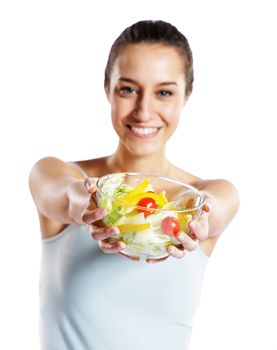 girl holding plate with salad on white background