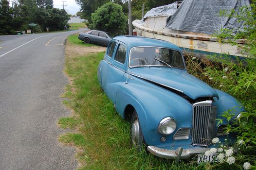 Blue retro car on the road, New Zealand