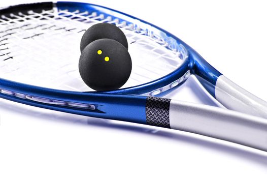 Blue and silver squash racket and ball on a white background with space for text