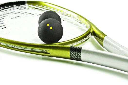 Green and silver squash racket and ball on a white background with space for text