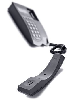 Black telephone on white with space for text