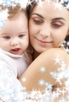 picture of happy mother with baby and snowflakes