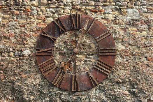 Ancient Clock Face in Zagreb on the wall near the cathedral. "Time passing by" theme related background.