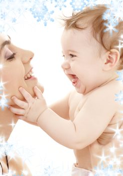 picture of happy mother with baby boy and snowflakes