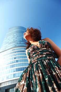  glamorous girl in the background of a skyscraper