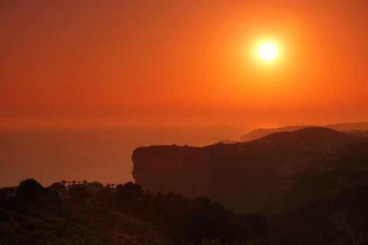 Summer landscape in mountains with the sun